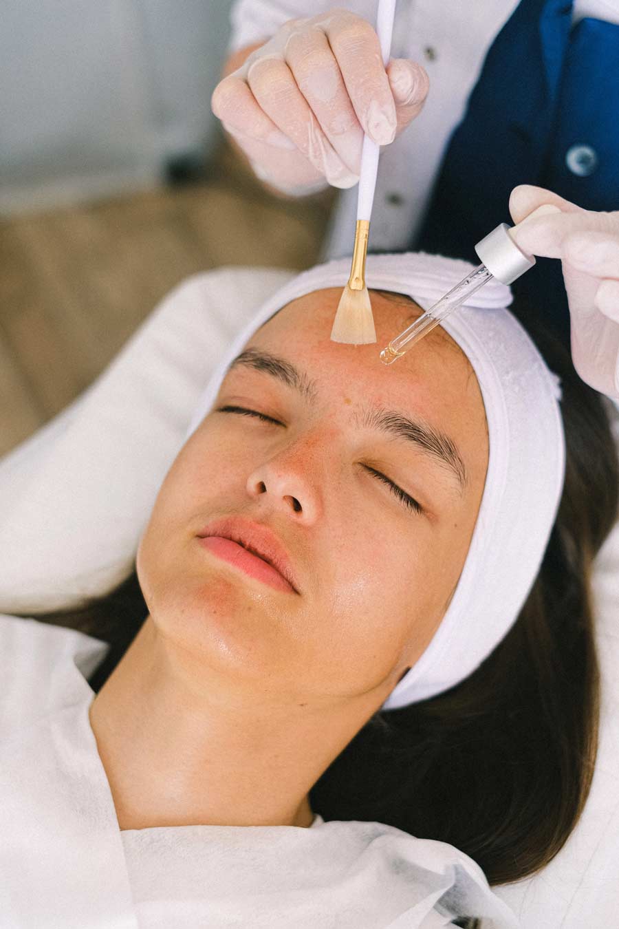 Woman receiving a glycolic acid peel